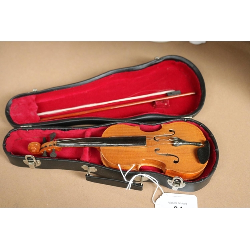 34 - Cased miniature violin,  approx 8 cm D 22 cm W.