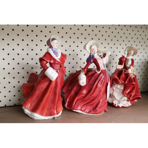 4 - Three Royal Doulton china figures, titled The Skater, Autumn Breezes, Top of the Hill, approx 20cm H... 