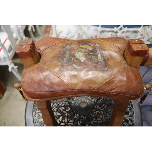 536 - Vintage camel stool, leather saddle, approx 51cm H x 64cm L