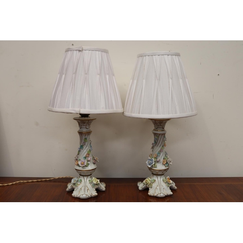 561 - Pair of German porcelain flower encrusted lamps, approx 48cm H each