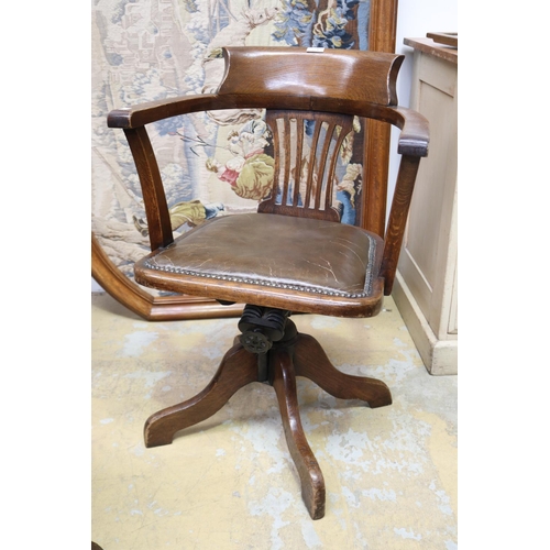 573 - Antique 1920's swivel oak desk chair. studded brown leather seat