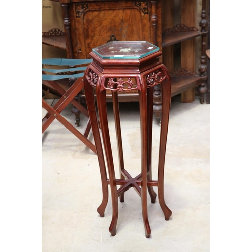 603 - Slender Oriental hardwood six leg jardinere stand, mother of pearl inlaid top surface