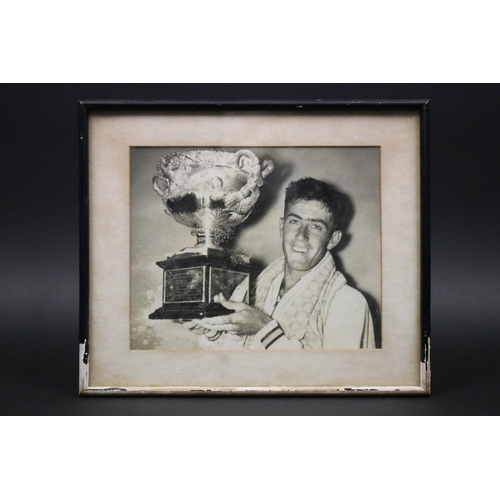 1156 - Ken holding the Australian Open trophy. One of the most iconic photographs of Ken, framed. Approx 19... 