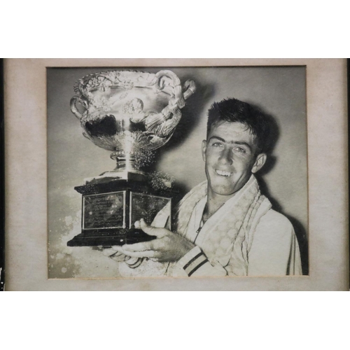 1156 - Ken holding the Australian Open trophy. One of the most iconic photographs of Ken, framed. Approx 19... 