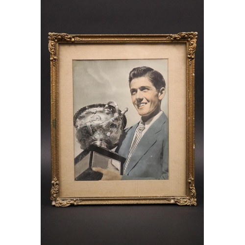 1226 - Framed photograph of Ken with the Australian Open trophy. Approx 24cm x 18cm. Provenance: Ken Rosewa... 