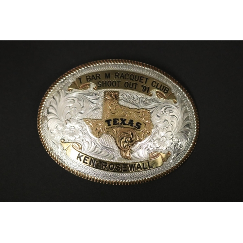 1199 - Tennis trophy. T BAR M RACQUET CLUB SHOOT OUT '91 TEXAS KEN ROSEWALL. Belt buckle in case. Approx 7.... 