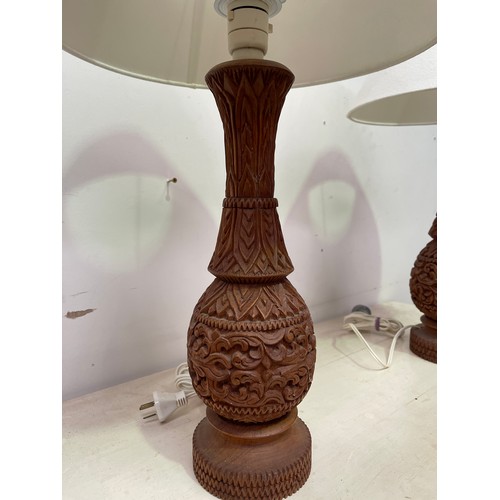 750 - Pair of Thai carved teak lamps (2) 60 cm high in total