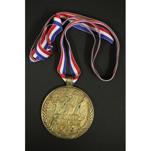 1292 - Tennis trophy medal. GRAND MASTERS 1986 HYATT REGENCY MAUI. Inscribed B.Vienna MAUI SS. Approx 7.5cm... 