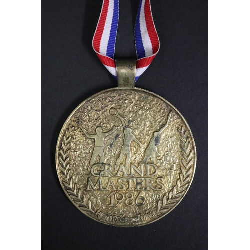 1292 - Tennis trophy medal. GRAND MASTERS 1986 HYATT REGENCY MAUI. Inscribed B.Vienna MAUI SS. Approx 7.5cm... 