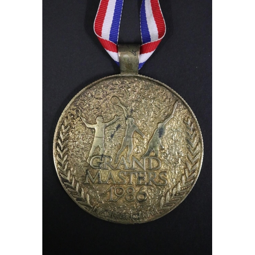 1292 - Tennis trophy medal. GRAND MASTERS 1986 HYATT REGENCY MAUI. Inscribed B.Vienna MAUI SS. Approx 7.5cm... 