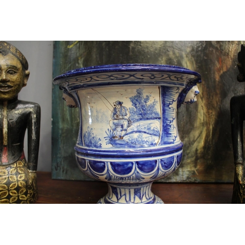 37 - Glazed blue and white footed jardiniere, lion masks and rural scenes, approx 40cm H x 38cm W