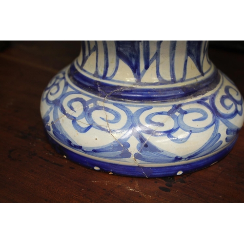 37 - Glazed blue and white footed jardiniere, lion masks and rural scenes, approx 40cm H x 38cm W