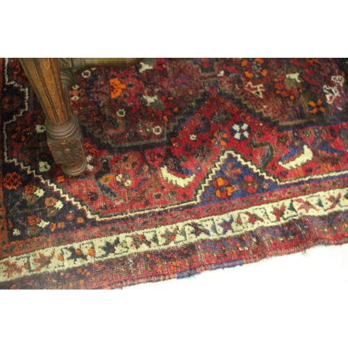 211 - Small hand knotted wool tribal carpet, geometric design, approx 115cm x 155cm