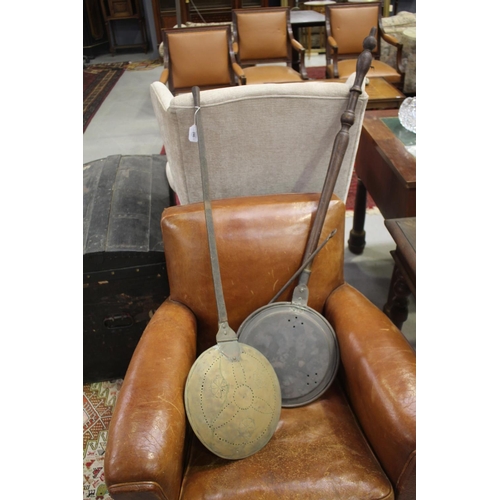 246 - Two antique copper bed warming pans, and iron handle (3)