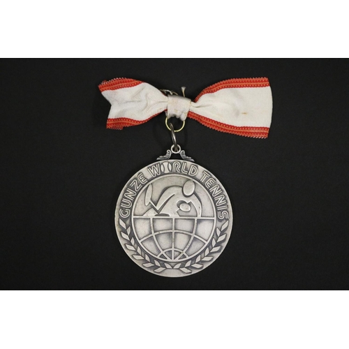 1319 - Tennis trophy medal. Inscribed, GUNZE WORLD TENNIS. RUNNER-UP 2ND GUNZE WORLD TENNIS 1975 23.24.25 N... 