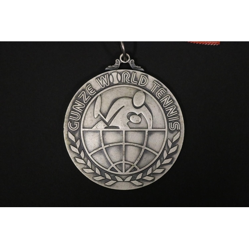 1319 - Tennis trophy medal. Inscribed, GUNZE WORLD TENNIS. RUNNER-UP 2ND GUNZE WORLD TENNIS 1975 23.24.25 N... 