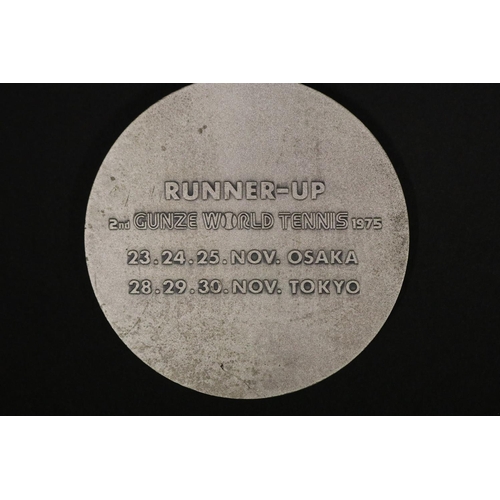 1319 - Tennis trophy medal. Inscribed, GUNZE WORLD TENNIS. RUNNER-UP 2ND GUNZE WORLD TENNIS 1975 23.24.25 N... 