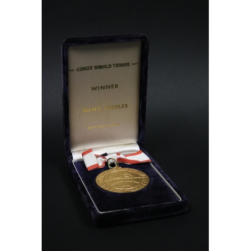 1320 - Tennis trophy medal. Inscribed, GUNZE WORLD TENNIS. WINNER 2ND GUNZE WORLD TENNIS 1975 23.24.25.NOV.... 