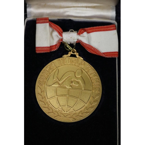 1320 - Tennis trophy medal. Inscribed, GUNZE WORLD TENNIS. WINNER 2ND GUNZE WORLD TENNIS 1975 23.24.25.NOV.... 