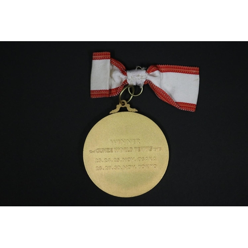 1320 - Tennis trophy medal. Inscribed, GUNZE WORLD TENNIS. WINNER 2ND GUNZE WORLD TENNIS 1975 23.24.25.NOV.... 