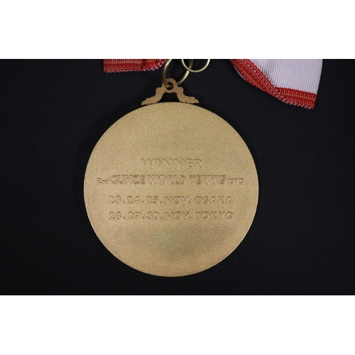 1320 - Tennis trophy medal. Inscribed, GUNZE WORLD TENNIS. WINNER 2ND GUNZE WORLD TENNIS 1975 23.24.25.NOV.... 