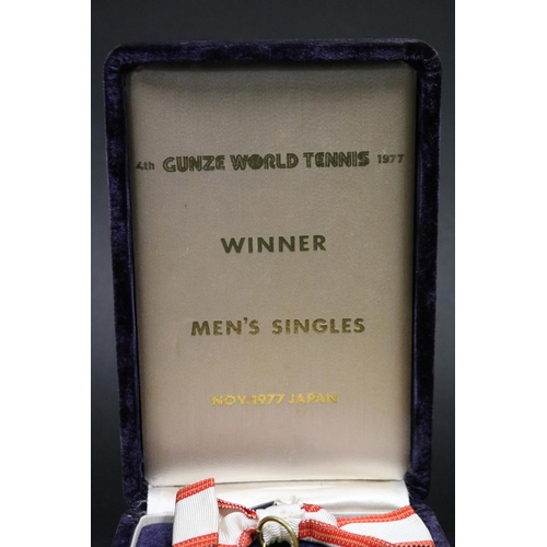 1320 - Tennis trophy medal. Inscribed, GUNZE WORLD TENNIS. WINNER 2ND GUNZE WORLD TENNIS 1975 23.24.25.NOV.... 