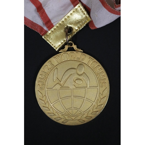 1321 - Tennis trophy medal. Inscribed, GUNZE WORLD TENNIS. WINNER 3RD GUNZE WORLD TENNIS 1976 21.23.24.NOV ... 