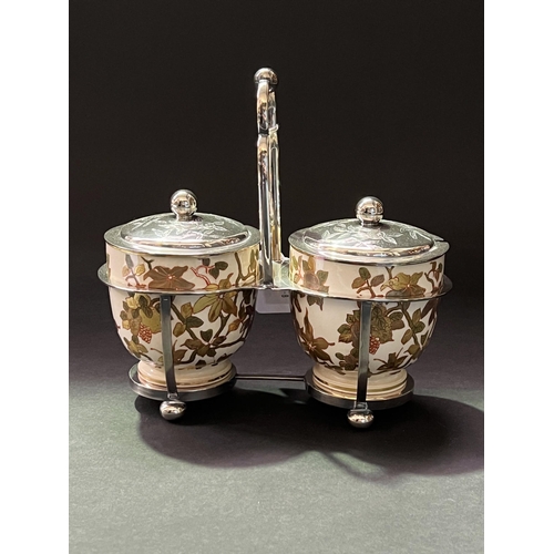 45 - Antique twin pot condiment set, with raised gilt and painted decoration,  silver plated frame approx... 