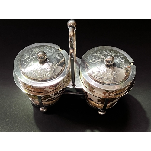 45 - Antique twin pot condiment set, with raised gilt and painted decoration,  silver plated frame approx... 
