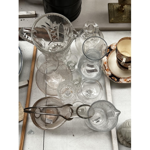 118 - Assortment of glassware. wine carafe, with metal frame, cut crystal jug, approx 26 cm H and smaller.