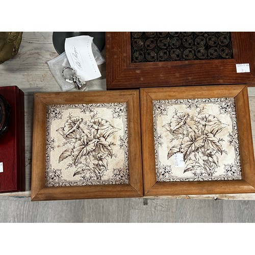 206 - Pair of framed antique transfer printed tiles, along with miscellanea, candlesticks, cast head, Russ... 