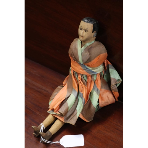 246 - Articulated doll in stripped  dress, approx 31cm L