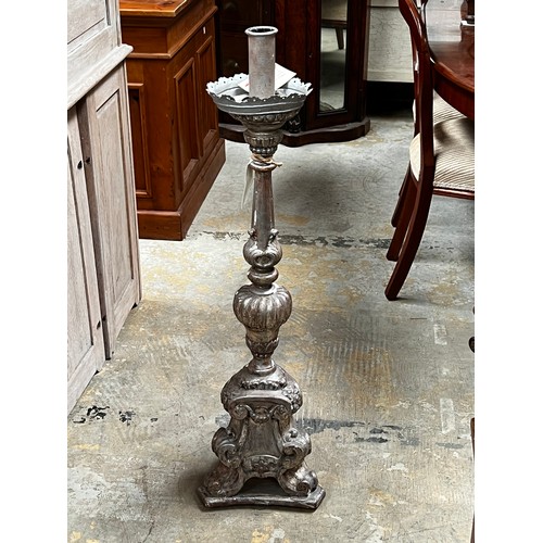 398 - Silver finished Pricket form candle holder, approx 99cm H