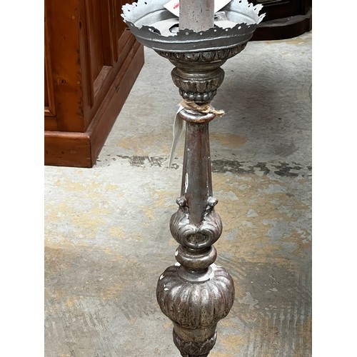 398 - Silver finished Pricket form candle holder, approx 99cm H