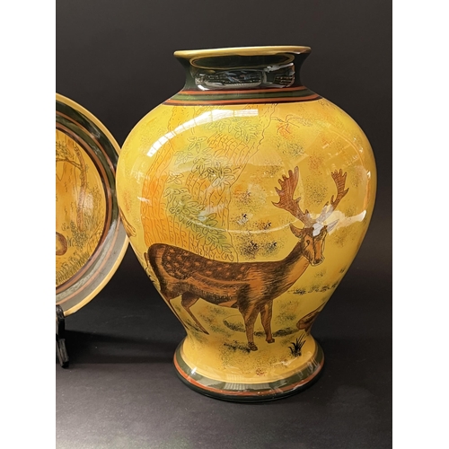 422 - Five piece decorative vase, pot, bowl and plates, approx 33cm and shorter, decorated with deer in la... 