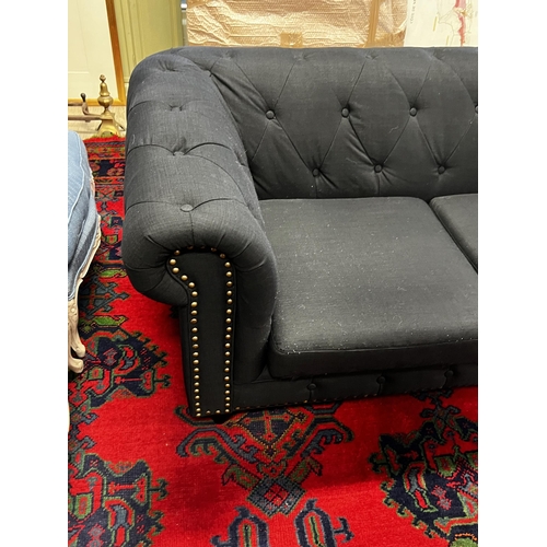 477 - Indigo  two seater chesterfield with studded trim to the front , approx 175cm W