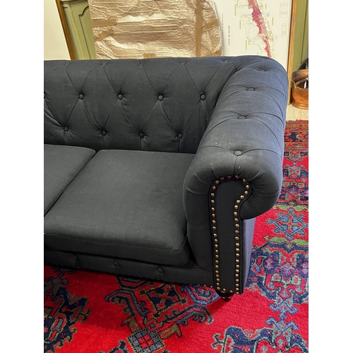 477 - Indigo  two seater chesterfield with studded trim to the front , approx 175cm W