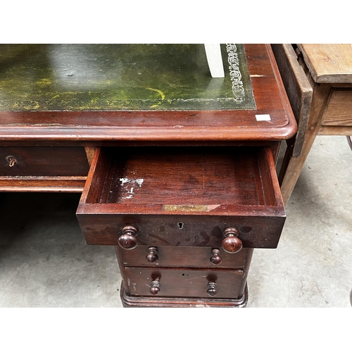 489 - Twin pedestal desk with green tooled leather, approx 77cm H x 137cm W x 75cm D