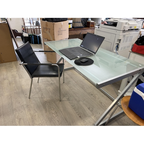 496 - Modern frosted glass topped desk and an stiched black leather chrome frame office arm chair, desk ap... 