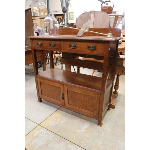 519 - Antique Arts and Crafts oak dumb waiter, fitted with two drawers and cupboard below circa 1920, appr... 