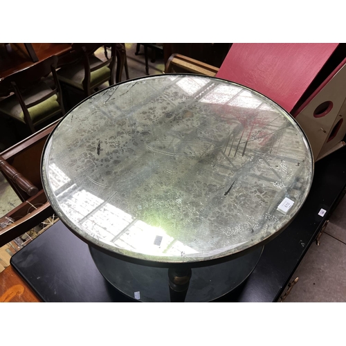 540 - Modern distressed circular mirrored top coffee or lamp table, distressed painted brass lags, under s... 