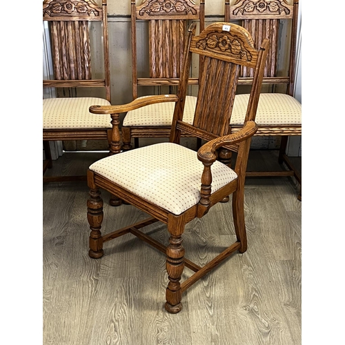 551 - Set of four American Oak turned leg dining chairs, to include one with arms  each with carved decora... 