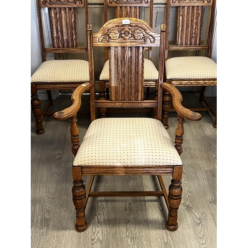 551 - Set of four American Oak turned leg dining chairs, to include one with arms  each with carved decora... 