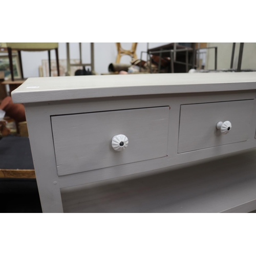 571 - Modern painted four drawer sideboard servery, drawers fitted with white china pulls, open shelves be... 