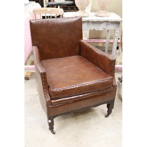 586 - Vintage faux brown leather studded trim arm chair