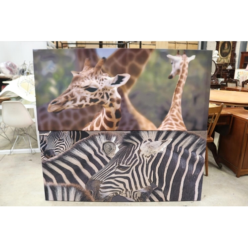 587 - Two decorative canvas's of a Zebra and Giraffe, approx 68cm x 147cm each (2)