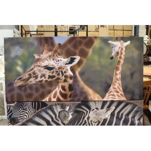 587 - Two decorative canvas's of a Zebra and Giraffe, approx 68cm x 147cm each (2)