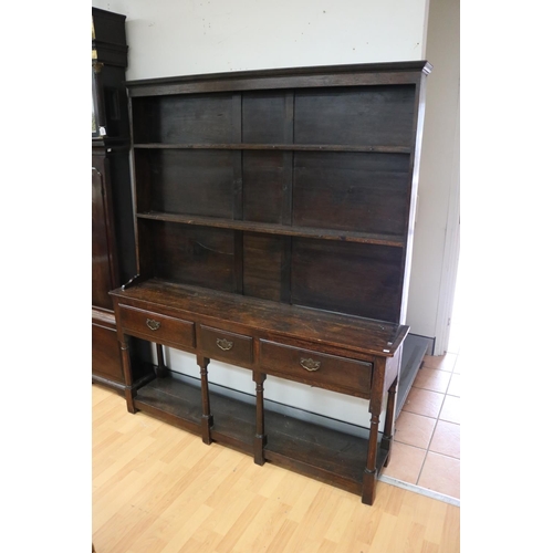 612 - Antique English 18th century revival oak pot board dresser, fitted with three drawers, with turned b... 