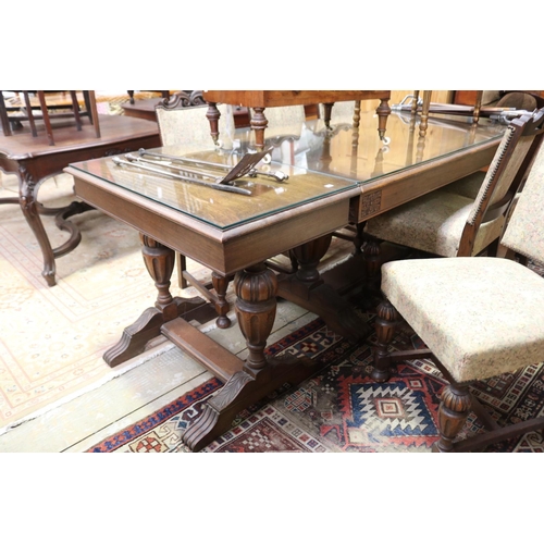 643 - English oak Tudor style dining suite - comprising a table with add on end table extensions. And matc... 