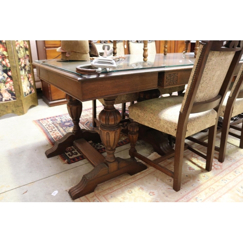 643 - English oak Tudor style dining suite - comprising a table with add on end table extensions. And matc... 